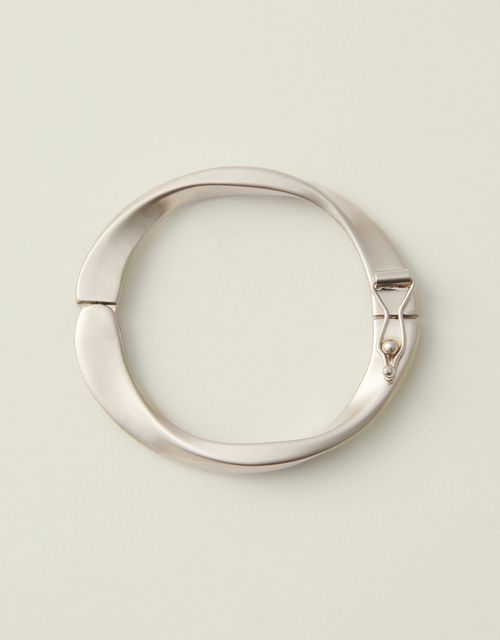Bracelete metal torcido