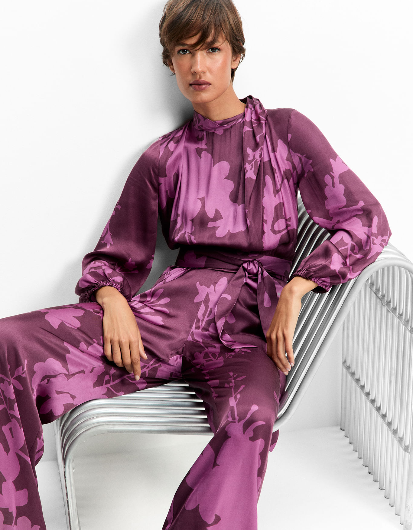 Macacão manga longa floral fucsia